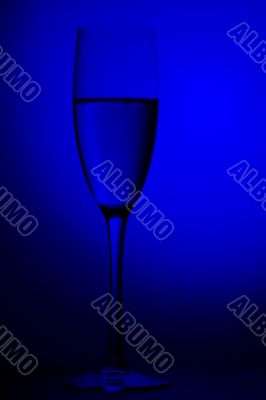 champagne glasses on blue