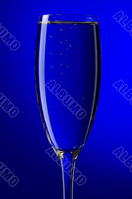 On blue background champagne glasses macro