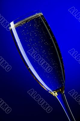 On blue background champagne glasses