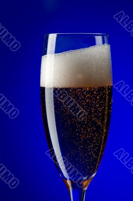 On blue champagne glasses close up
