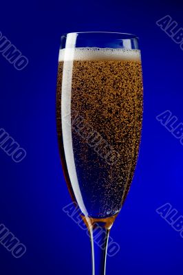 On blue champagne glasses closeup