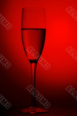 On red background champagne glasses