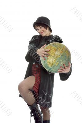 Beautiful brunette with valise and globe