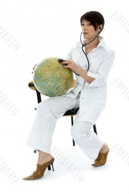 young doctor with stethoscope and globe