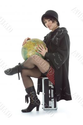 Beautiful brunette with valise and globe