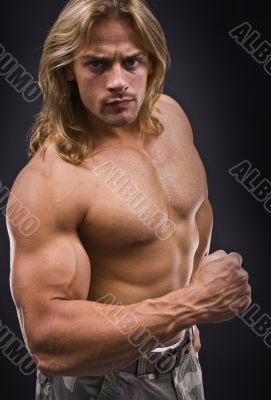Sexy muscular man isolated on black