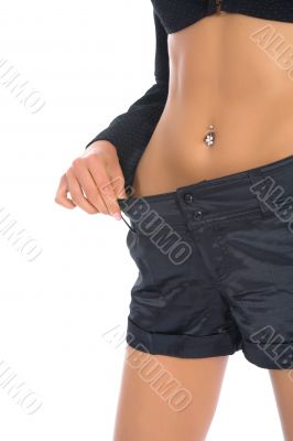 Woman showing how much weight she lo