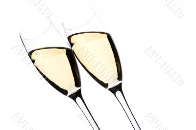Two glasses champagne on white closeup