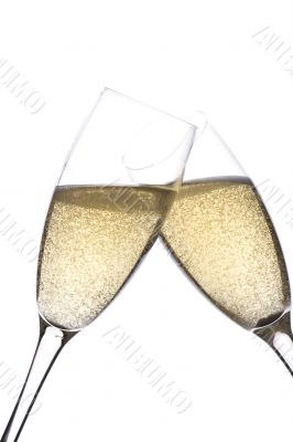 Two glasses champagne on white