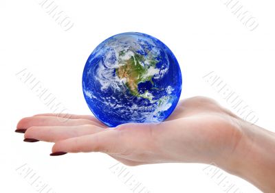 female hand holding globe