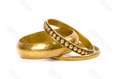 three golden bracelets