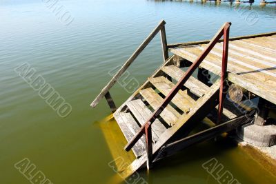 Wooden stairs into water