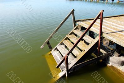 Wooden stairs into water