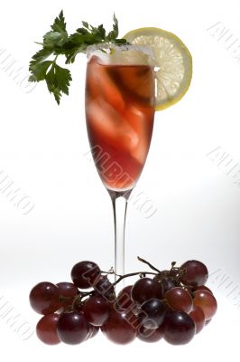 champagne glasses with red grapes