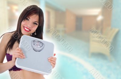 beautiful girl with  scales on  white background