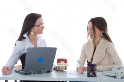 Two business woman advertises real estate on white
