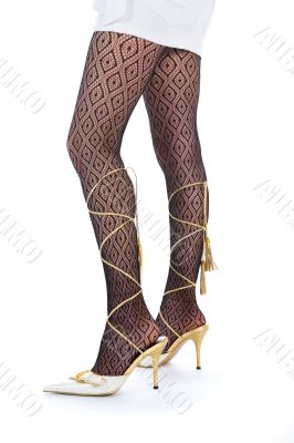 Long woman legs  in white dancing-slippers