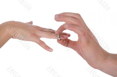 Man`s and female hands with a wedding ring