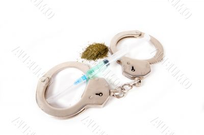 Handcuffs and syringe