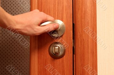 The hand opening a door
