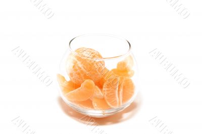 Tangerine segments in a glass bowl