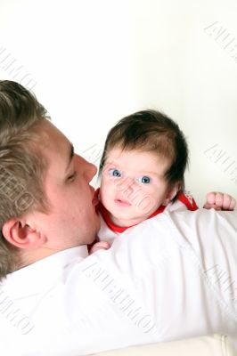 father carries his baby 