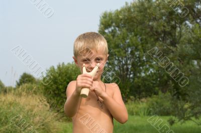 Boy with a slingshot.