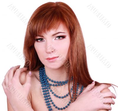 Young woman with blue beads