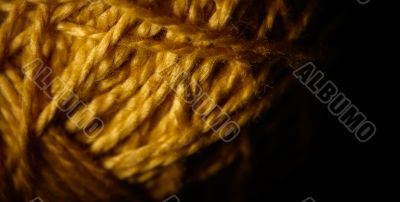 Macro shot of a ball of string texture isolated on black