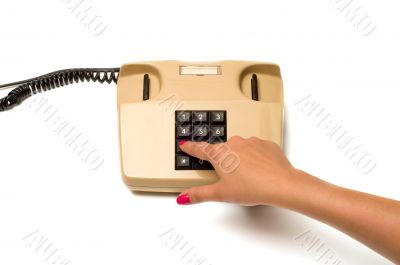 Hand and telephone.