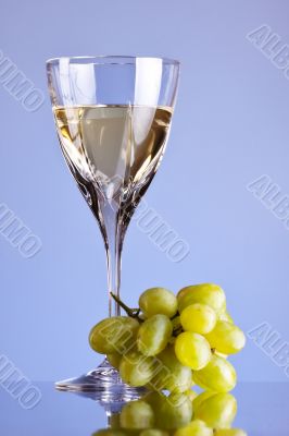 glass of white wine and grape