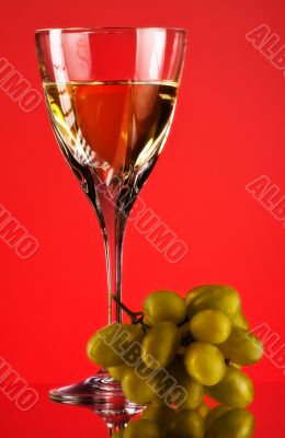 glass of white wine and grape
