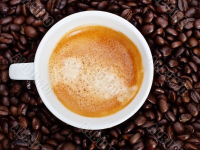 espresso cup in coffee beans
