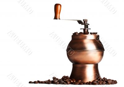 vintage coffee grinder standing on beans