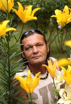 The man among yellow lilies
