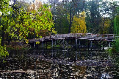 Wooden bridge at the park in autumn 