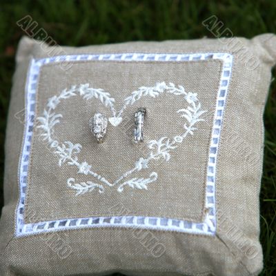 wedding rings on a pillow