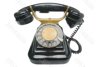 Old vintage black phone with disc dials with cliping path.