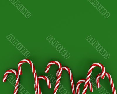 Christmas candies on green background