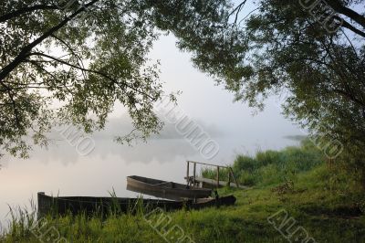 Boats in a morning fog