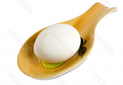 White egg in a spoon