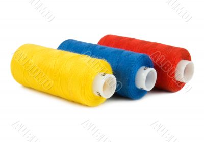 Three spools of threads
