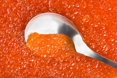 Spoon into red caviar