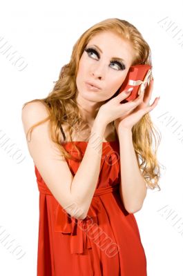 Woman in red dress holding gift-box