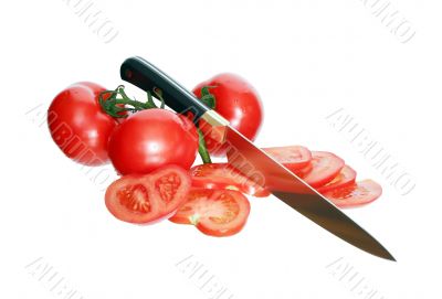 Sliced Tomatoes And Knife