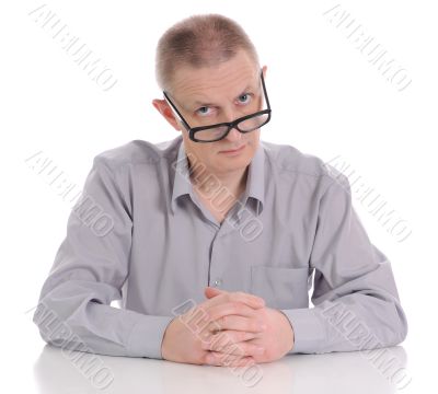 The man looking atop of glasses