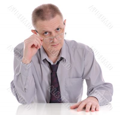 The man looking atop of glasses