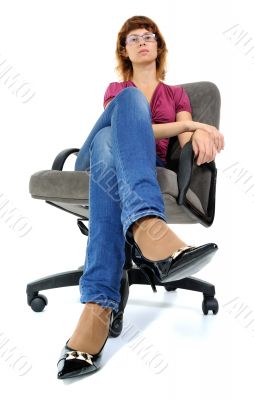 The women sitting in an armchair.