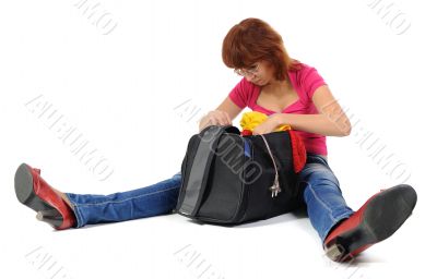 Women looks in her bag