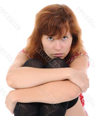 The young woman sitting on a floor